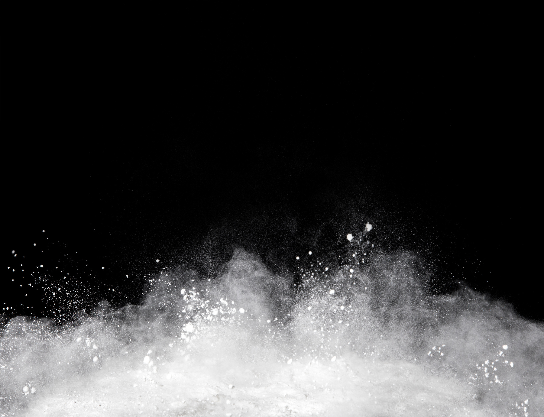 white powder splash on black background